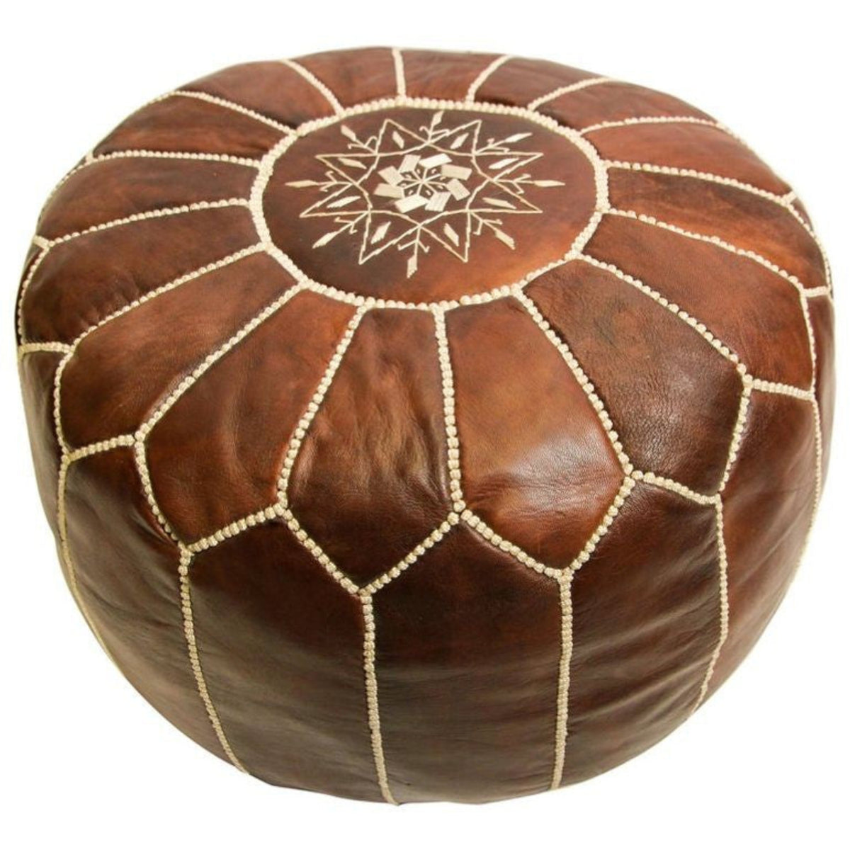 A round brown leather pouf ottoman with cream-colored stitched panel lines and a geometric star pattern in the center, shown on a plain white background.