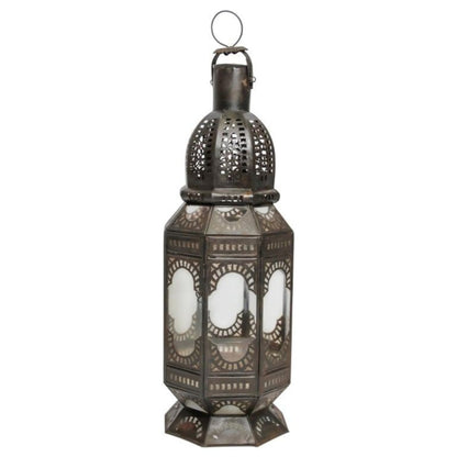 A handcrafted Moroccan clear glass lantern with metal Moorish filigree designs and a hurricane candle lamp. 