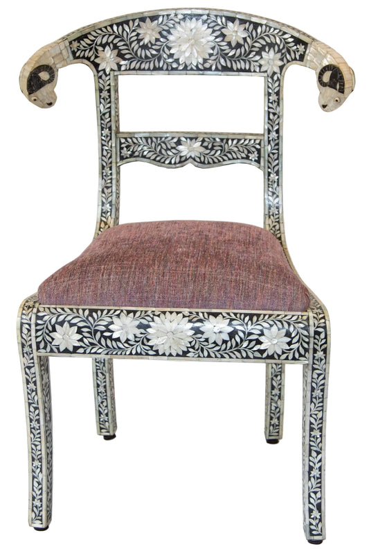 Anglo-Indian Mughal black and white mother of pearl and bone inlaid side chair with ram's head detail on a white background.