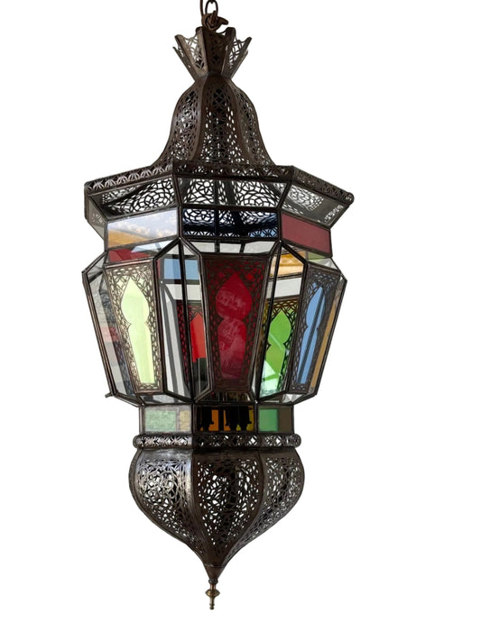 A Moroccan Moorish hanging light fixture with clear glass and intricate metal filigree, featuring a bronze metal color finish and colored glass in red, blue, green, and amber.