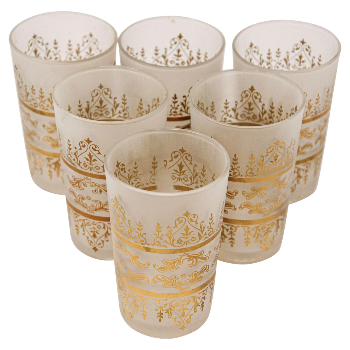 Six frosted glass tumblers with ornate gold damask patterns, arranged on a plain white background.