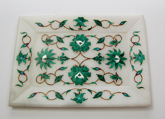 A rectangular white marble mosaic inlay dish with green malachite, shell, and abalone inlays, featuring a floral pattern with geometric and botanical designs.