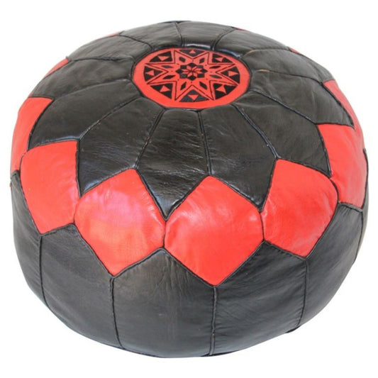 A vintage Moroccan red and black round leather pouf with hand tooled patterns.