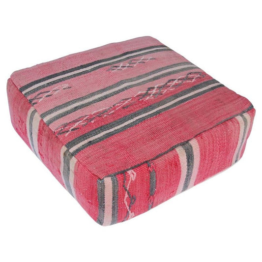 A vintage Moroccan red and black striped floor pillow made from a handwoven tribal Berber rug.