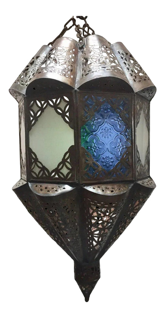 A handcrafted Moroccan lantern with frosted milky glass and Moorish filigree metal designs, featuring a black cord.