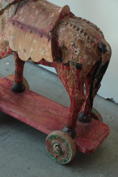 Pair of Monumental Indian Polychrome Carved Wood Horses on Wheels, 19th C.