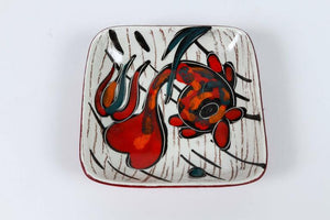Four Italian Leather Backed Decorative Ceramic Dishes
