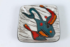 Four Italian Leather Backed Decorative Ceramic Dishes