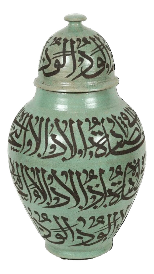 A large green Moorish ceramic urn with chiseled Arabic calligraphy writing in black.