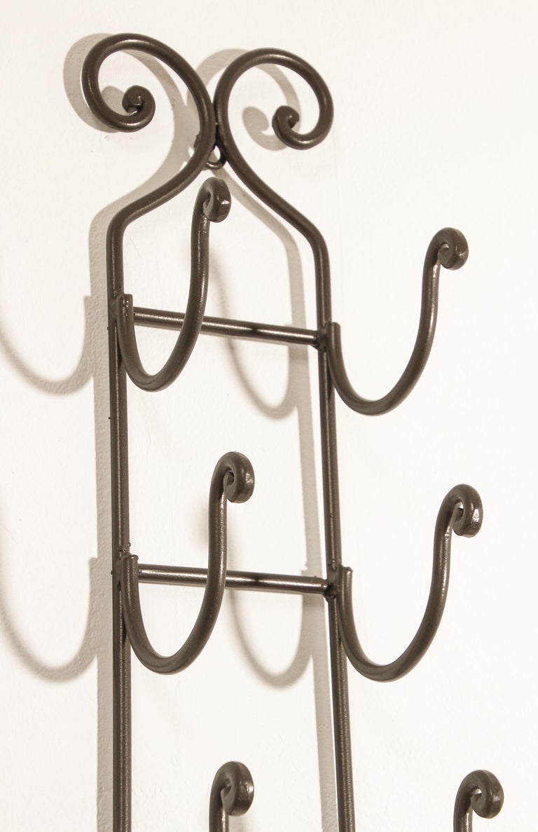 Wrought iron wall wine rack discount
